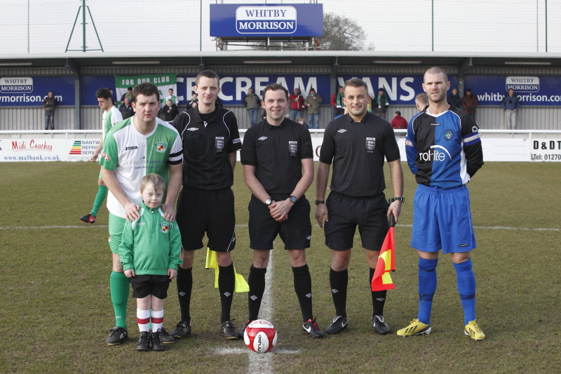 Adam as mascot at Nantwich Town FC with the Officials and team Captains